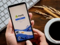 Hand holding smartphone showing Shopify login page for cross-border independent store sellers 