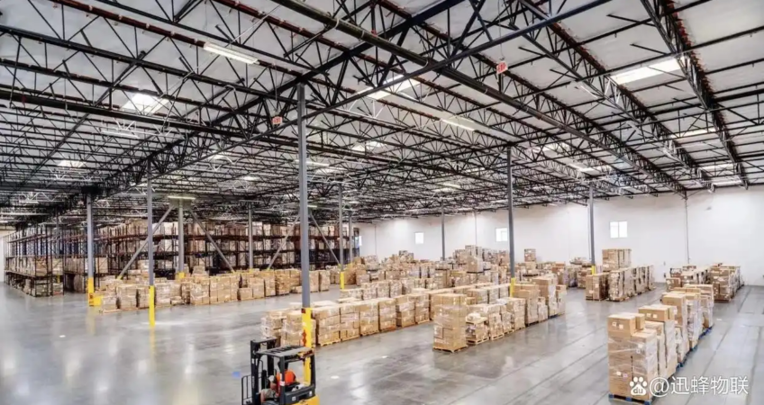 Spacious US fulfillment warehouse with stacked inventory and forklift