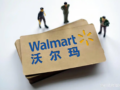 Miniature businessman figures standing on Walmart branded cards, cross-border supply chain and seller onboarding illustration